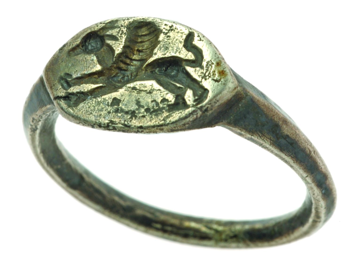 Silver signet ring with image of galloping griffin.