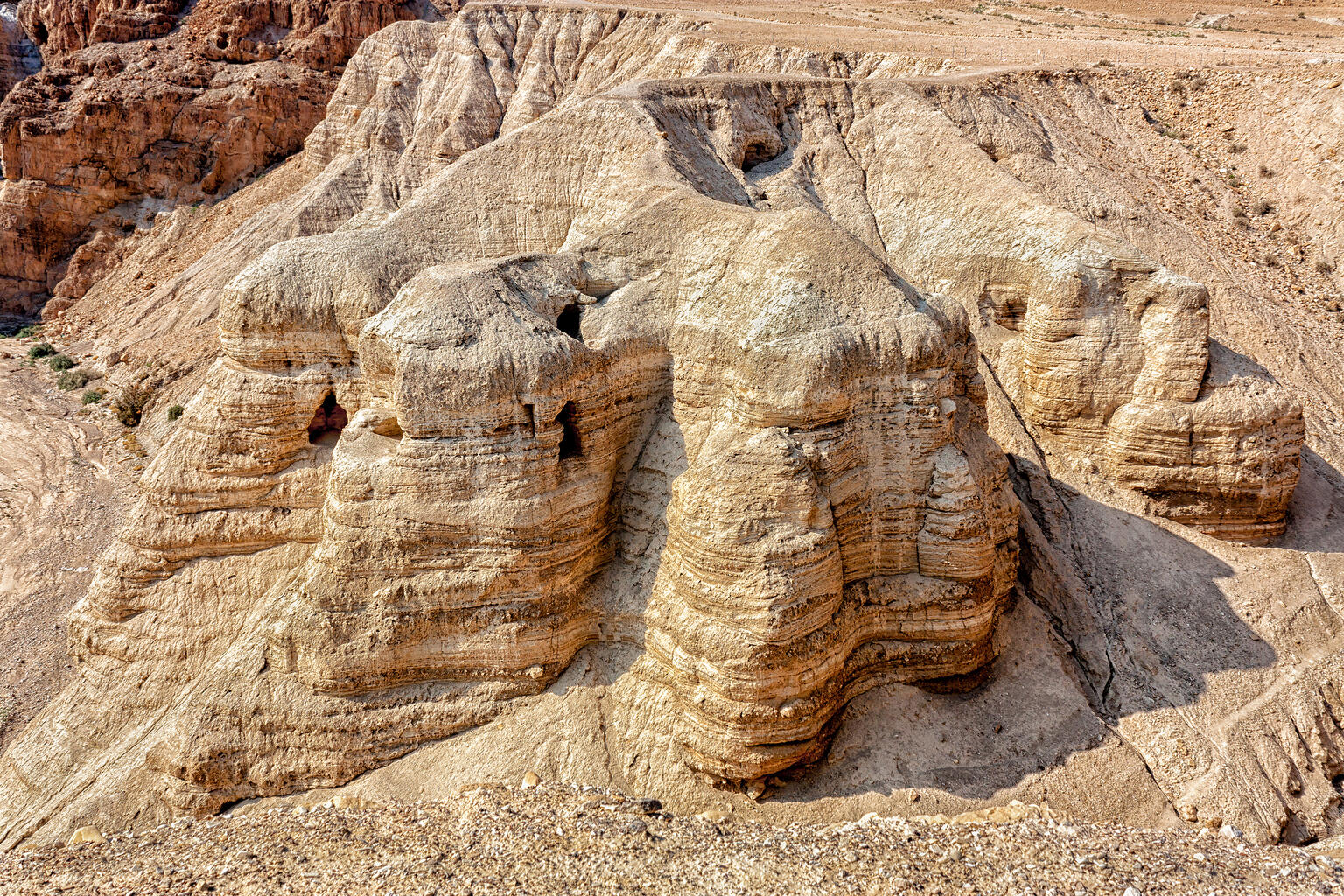 Aerial photograph of desert ridge with several openings.