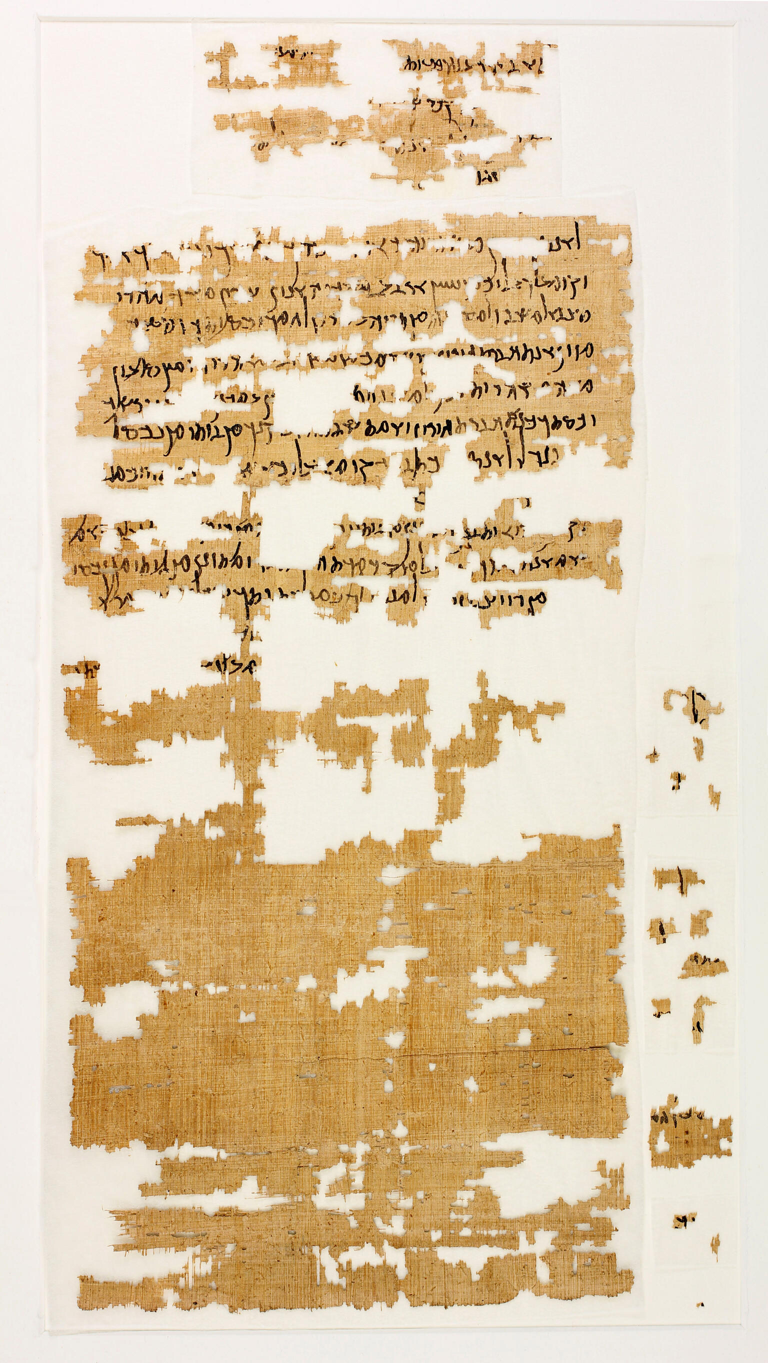 A fragmentary ancient papyrus manuscript with Greek text in black ink. The papyrus is yellowed and torn, with large missing sections.
