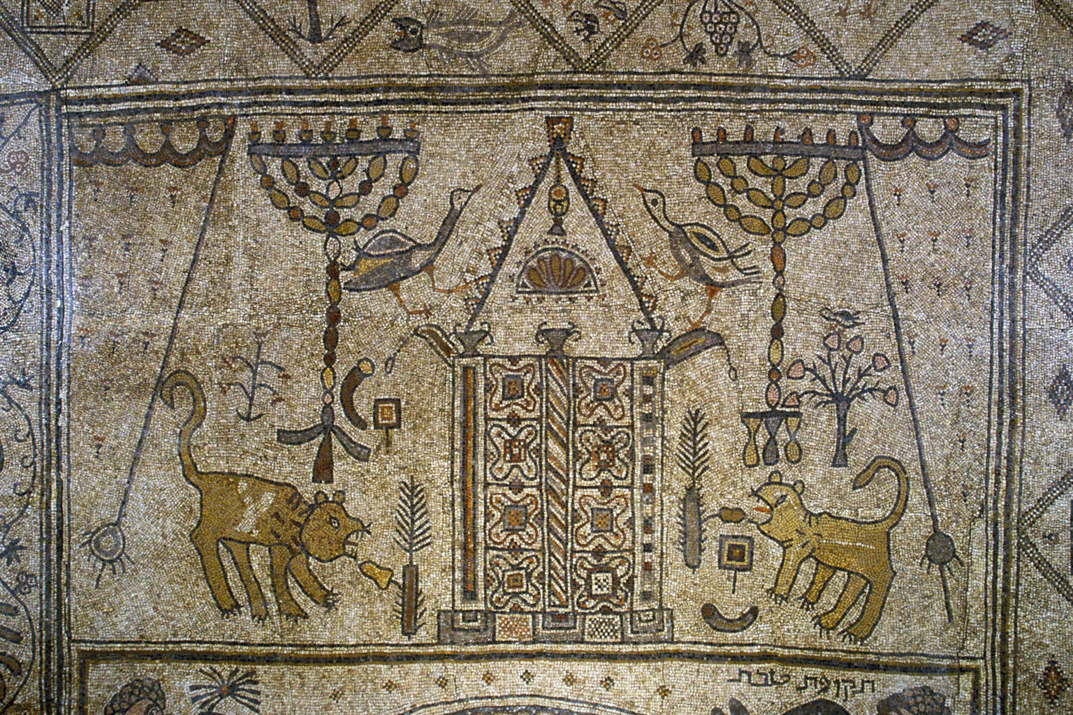 Ancient mosaic depicting a structure with ornate doors, flanked by birds, menorahs, lions, and ritual objects.