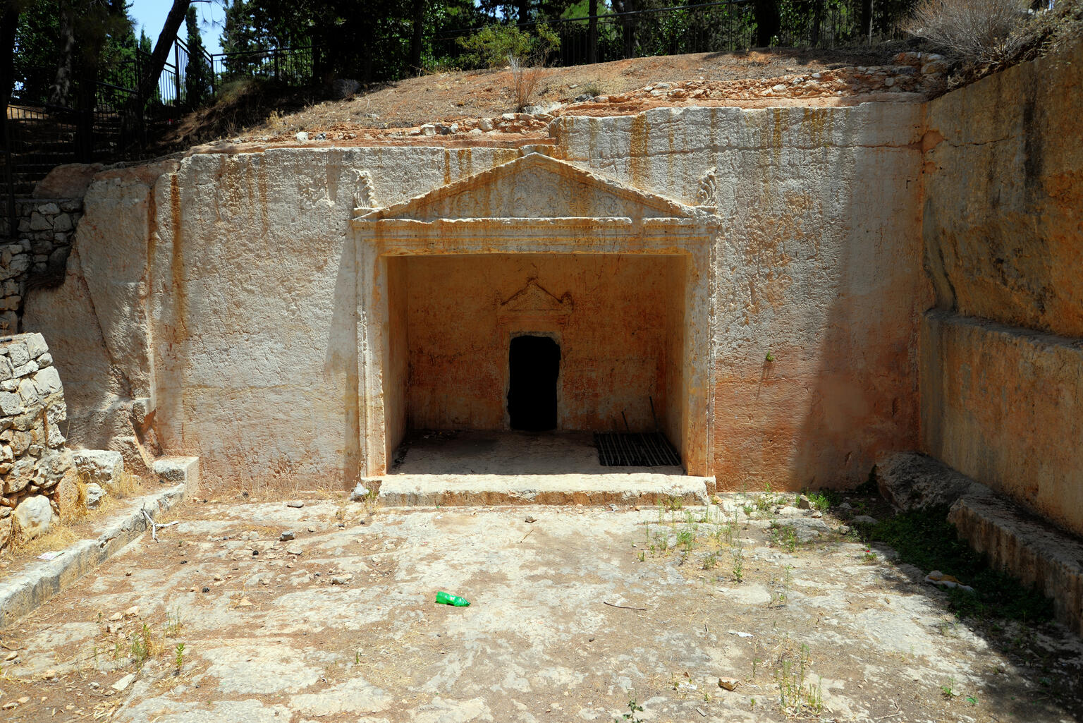 Doorway with triangular mantle cut out of rock. The doorway leads into a niche, within which is a smaller doorway, also with a triangular mantle.