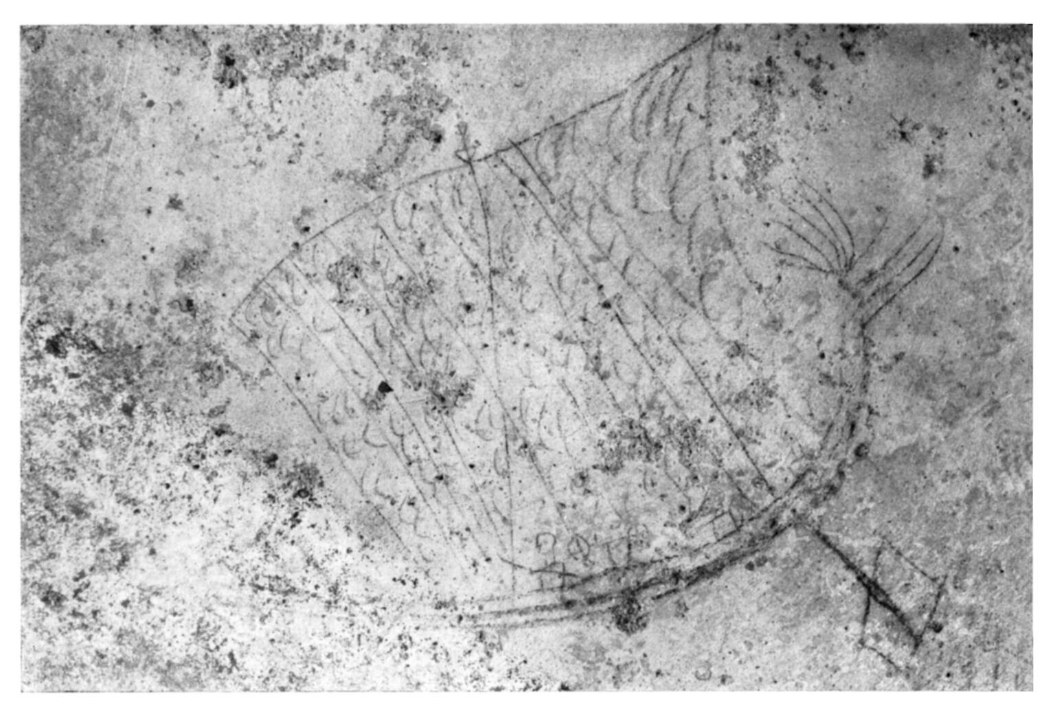 A faint, ancient wall drawing shows a simple sailboat with a large sail, visible lines suggesting rigging, and a textured, weathered surface around the sketch.