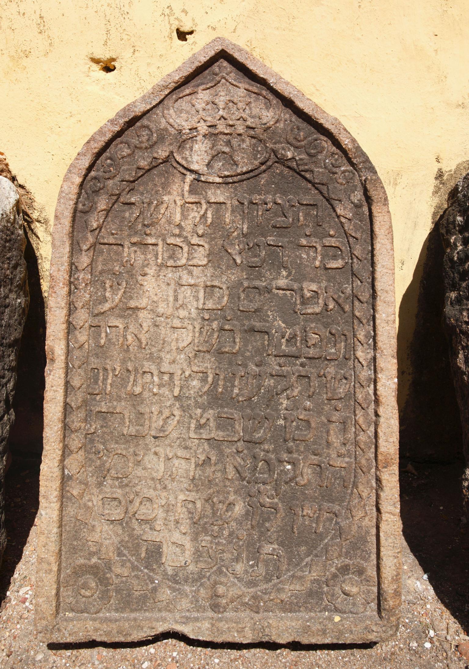 Tombstone with Hebrew text.