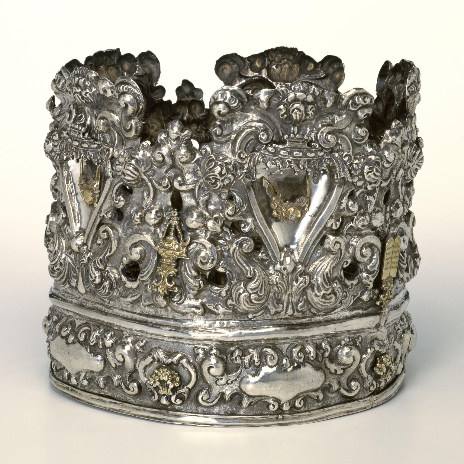 Crown with decorative carvings.