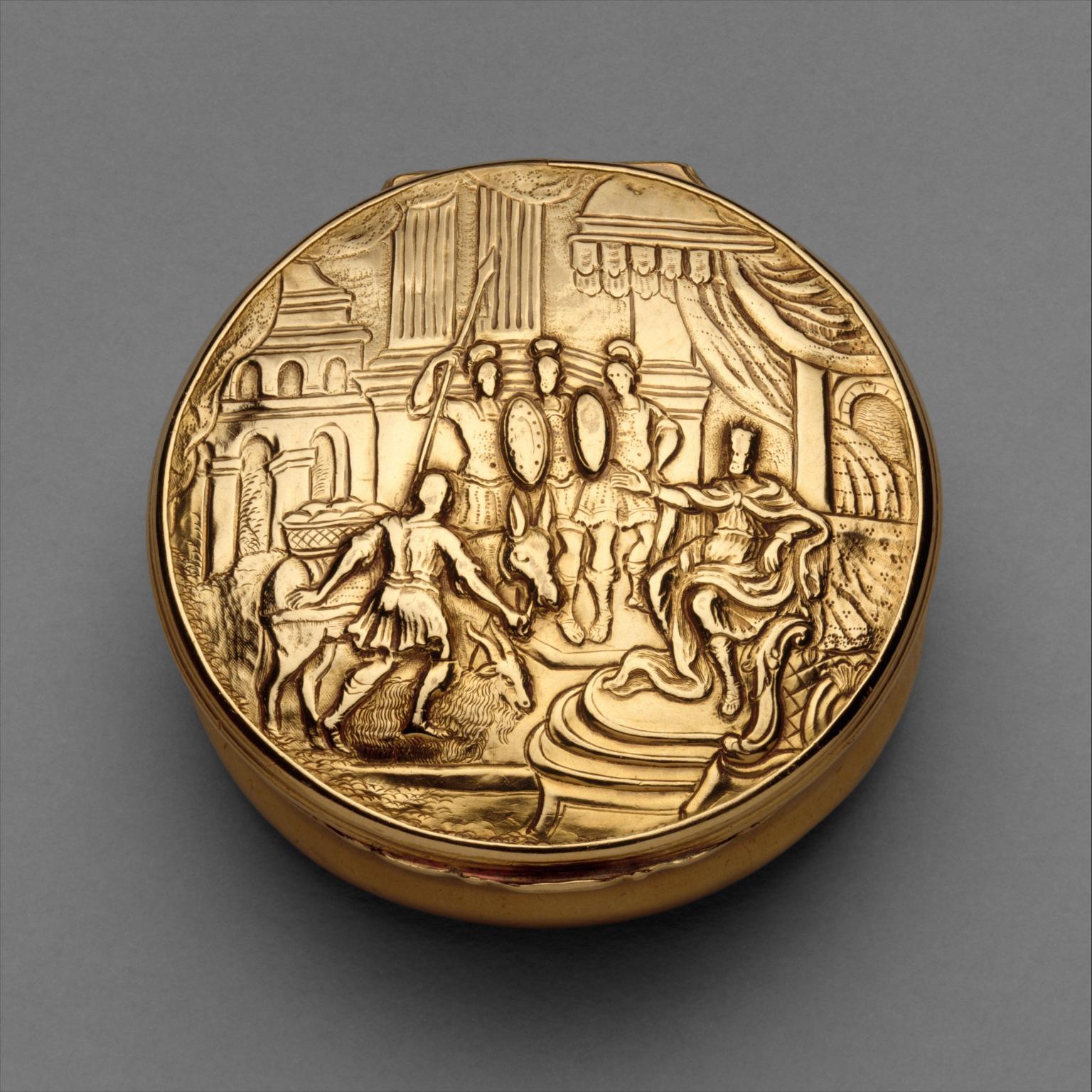Gold circular box featuring soldiers and men with donkeys.