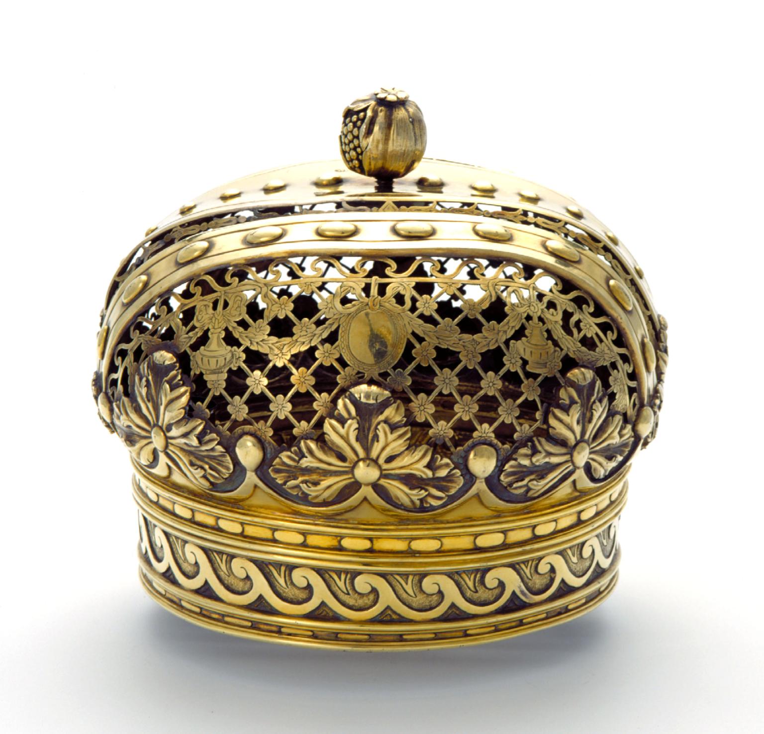 Gold crown decorated with floral motifs.