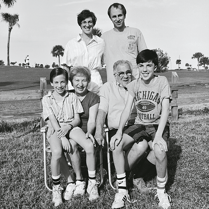 Photograph featuring lawn and awning over windows of house transposed over ocean; photograph of family with palm trees in background. 