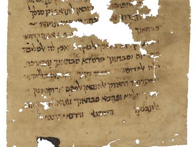 Damaged piece of parchment with writing in Hebrew script, some of which is obscured by large holes.