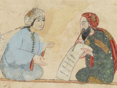 Colorful illustration showing two facing seated figures in robes and long turbans, one bearded and writing on a scroll with a pen and the other gesturing.