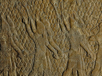 Relief with diamond pattern of people in cone-shaped hats swinging slingshots