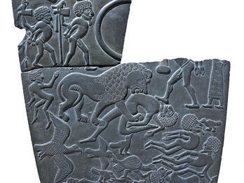 Battlefield with Prisoners and Corpses, on Egyptian Palette Stone decorated with animals, two figures with hands bound, and floating bodies, cracked on top.