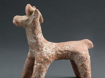 Horse with Object on Head Terra-cotta figurine of horse with ornament on head.