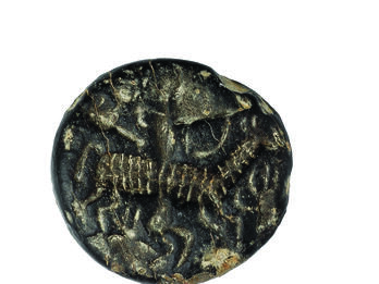 Seal with Archer Limestone seal with image of antelope and archer.