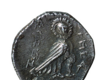 Coin with Owl and Inscription Coin with image of owl with body facing right and face turned towards the viewer and Hebrew inscription.