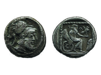 Front of coin depicting head with beard wearing helmet and back of coin depicting figure on winged chariot holding bird.