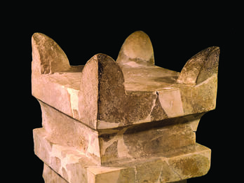 Small Limestone Altar from Megiddo Square limestone altar with horns at four upper corners and recessed band below offering surface.