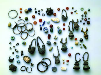 Collection of earrings and beads. 
