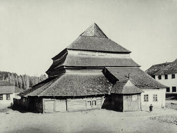 Gwoździec Synagogue, Galicia Photograph of wooden building exterior with several layers of roofs.