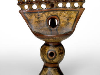 Hanukkah Lamp (Algeria) Oil lamp with geometric carvings.