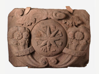 Huppah Stone (Traustein) Stone with carving of star in center and flowers on either side.