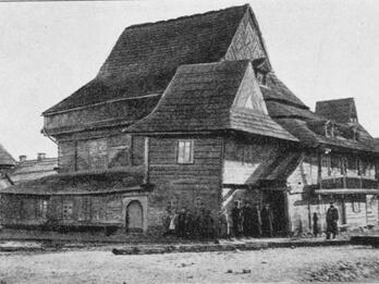 Zabłudów Synagogue, Poland Exterior photograph of wooden building with shingles.