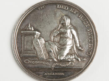 Medal Commemorating the Enfranchisement of the Jews of Westphalia by Jerome Bonaparte Medal featuring seated person next to Hebrew tablets and Latin text around.