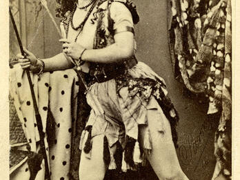 Portrait of Adah Isaacs Menken Full body portrait of woman with legs slightly bent and body shifted to one side in an active pose, wearing armor.