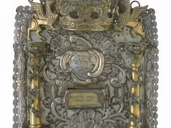 Torah Shield Shield with Hebrew text, gold columns, griffins, and crown on top.