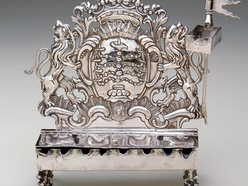 Hanukkah Lamp (Frankfurt am Main) Silver oil lamp with lions on each side and crown on top.