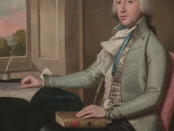 Portrait of Benjamin S. Judah Portrait painting of man seated at desk in front of an open window, facing viewer and holding a book in his lap with his right hand on desk.