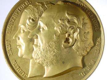 Medal with the Image of Judith and Moses Montefiore Medal featuring profile portraits of a man and woman.