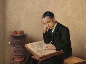 Painting of boy seated next to a stove studying a book.