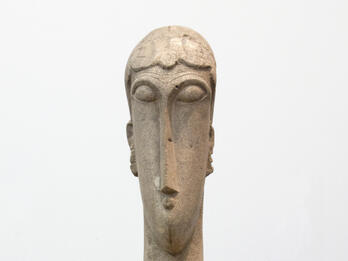 Sculpture of elongated head and neck.