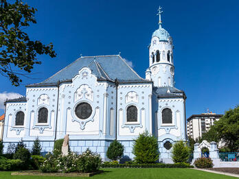 The Blue Church of St. Elizabeth Drawing of courtyard surrounded by low buildings.