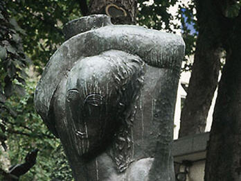 Rebecca, or The Large Woman Carrying Water Sculpture of stylized nude woman carrying water over her head.