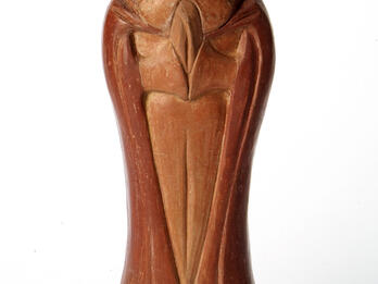 Moses’ Death Sculpture of bearded man wearing shawl, with mouth open and hands clasped.