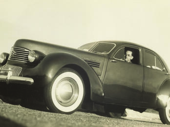 Self-Portrait in Graham Hollywood Car Low angle photograph of a man inside a car.