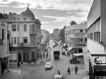 Nahalat Binyamin Street, Tel Aviv Aerial photograph of city intersection with some cars, bicycles, and people.