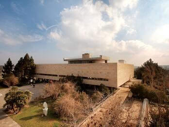 The National and University Library Aerial photograph of a rectangular building with a courtyard and trees.