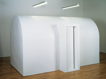 Cell No. 1 Art installation of large wooden domed structure with curved doorway.