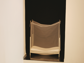Nocturne Installation depicting a wall inset with bed inside.