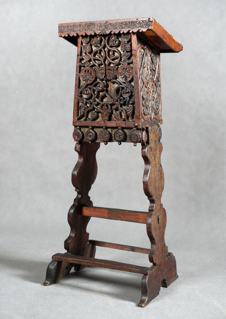 Wooden lectern with decorations.