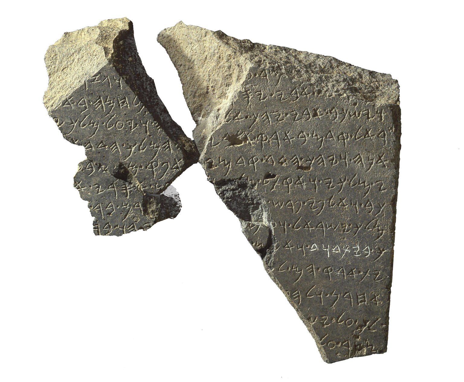 Stone tablet in two fragments inscribed with Hebrew writing.