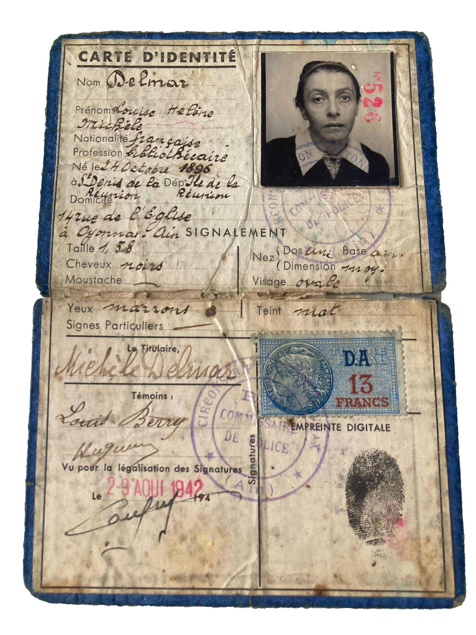 Folded identity document with woman's photo and French writing