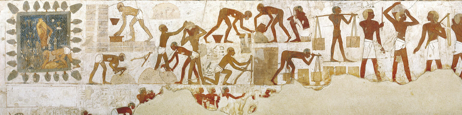 Mural of people carrying bricks, measuring blocks, and pouring buckets. Mural of people carrying bricks, measuring blocks, and pouring buckets.