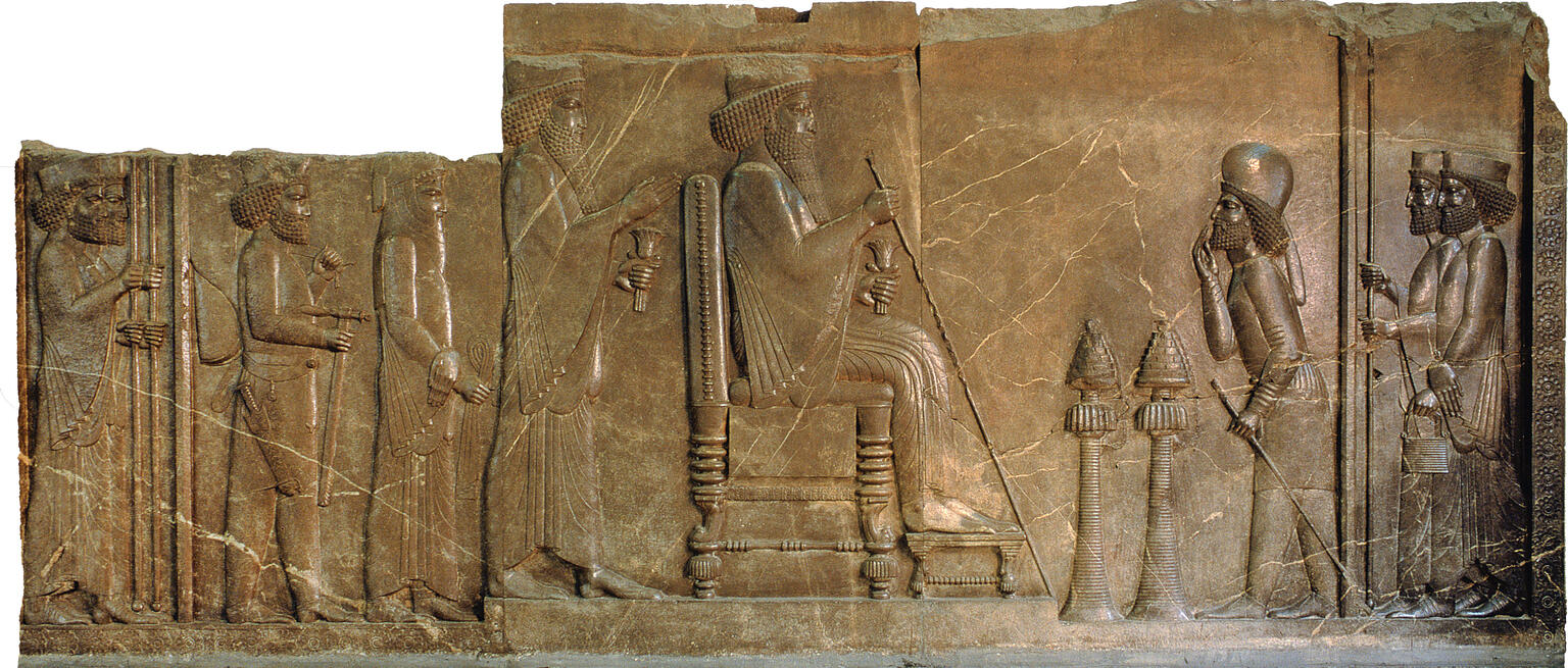Relief of man sitting on throne with figures standing on either side. Relief of man sitting on throne with figures standing on either side.