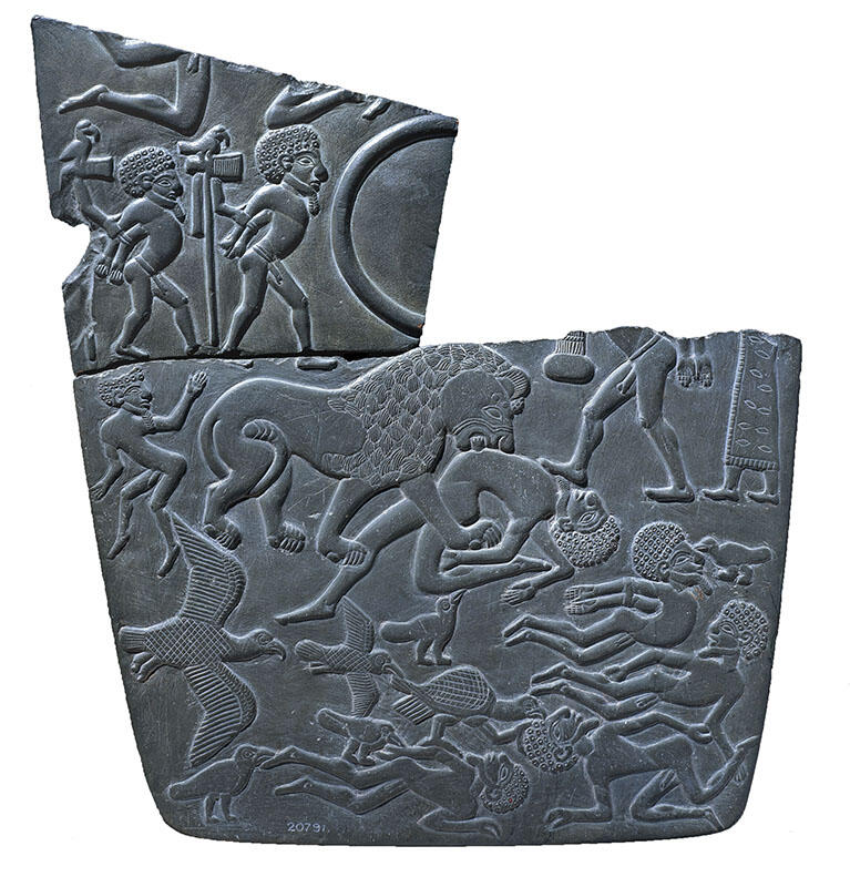 Stone decorated with animals, two figures with hands bound, and floating bodies, cracked on top. Stone decorated with animals, two figures with hands bound, and floating bodies, cracked on top.