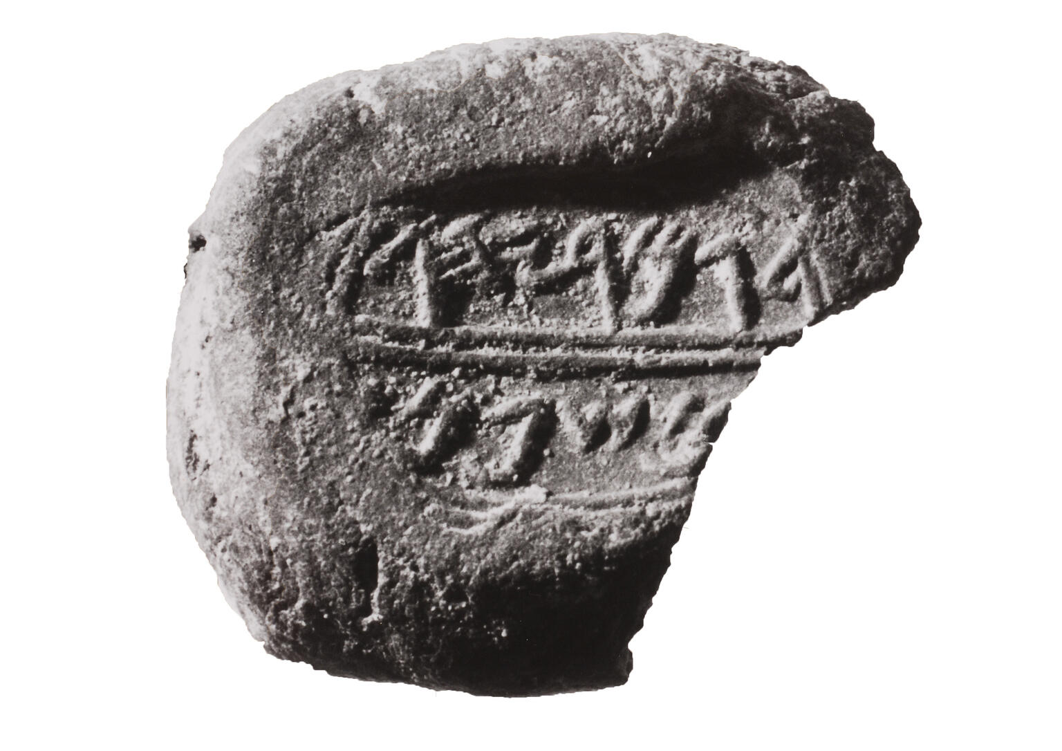 Round clay piece inscribed with Hebrew. Round clay piece inscribed with Hebrew.