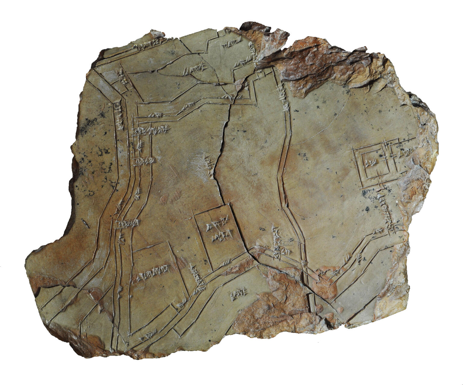 Tablet with etching of lines and squares, cracked in half. Tablet with etching of lines and squares, cracked in half.