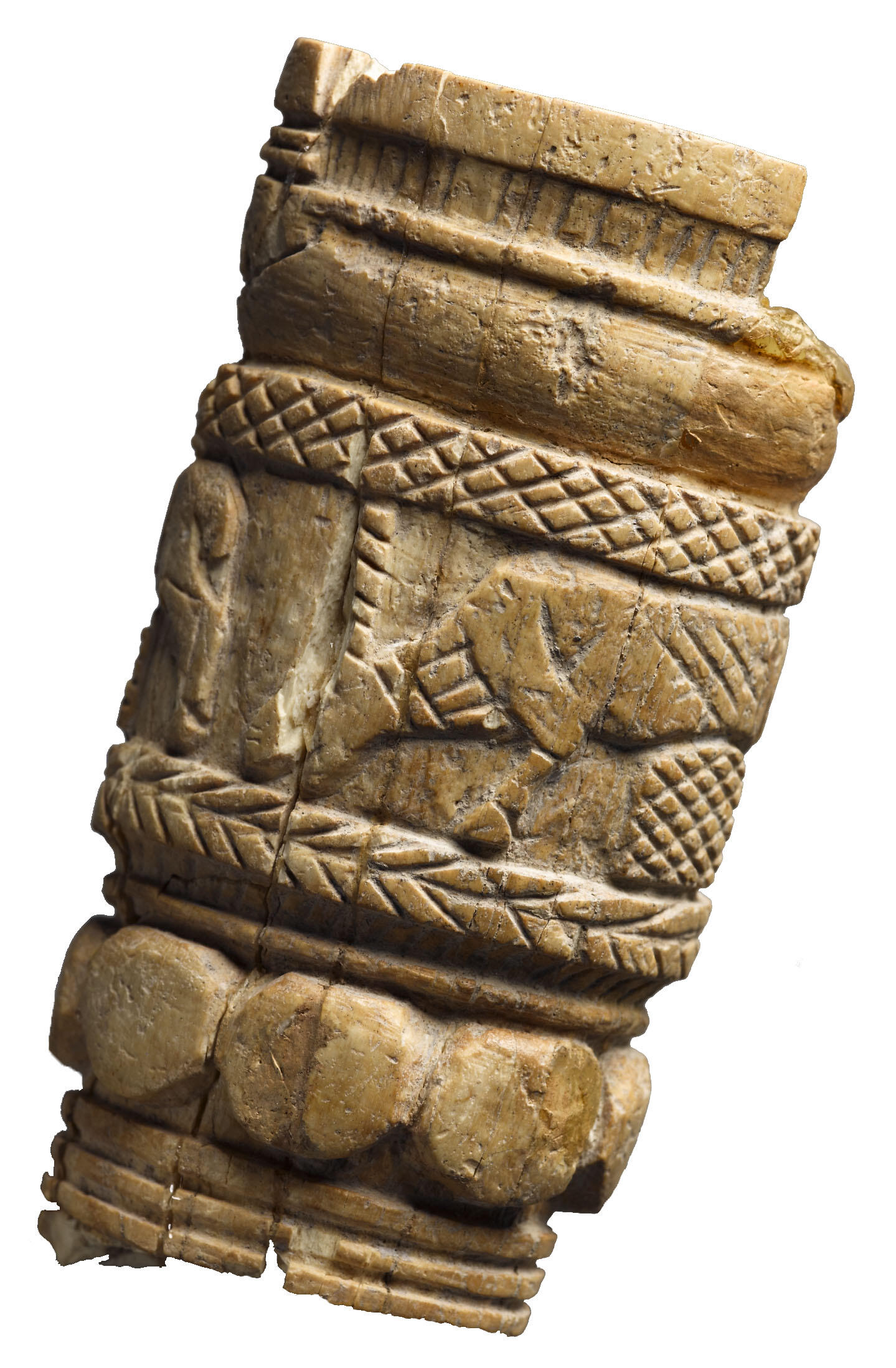 Ivory handle with carving of two grazing deer-like animals, herringbone motif, and a series of circles.